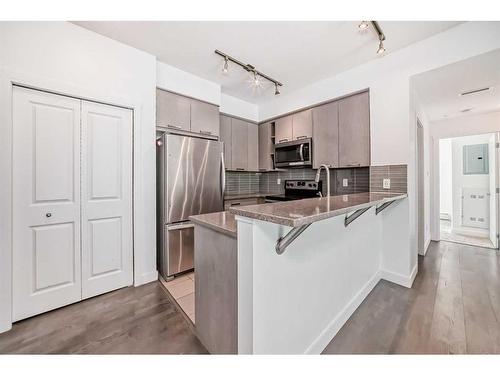 2104-175 Silverado Boulevard Sw, Calgary, AB - Indoor Photo Showing Kitchen With Stainless Steel Kitchen