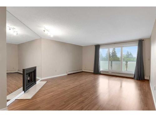 311-333 Garry Crescent Ne, Calgary, AB - Indoor With Fireplace