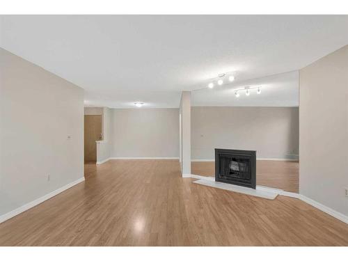 311-333 Garry Crescent Ne, Calgary, AB - Indoor With Fireplace