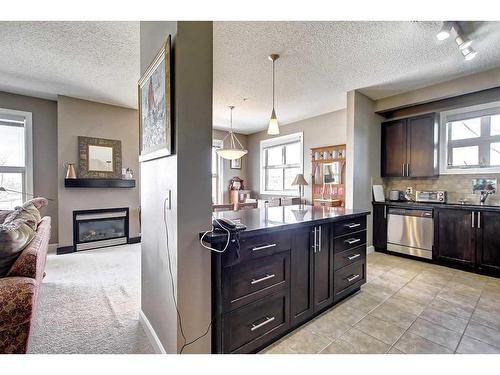 318-88 Arbour Lake Road Nw, Calgary, AB - Indoor Photo Showing Kitchen With Fireplace With Upgraded Kitchen