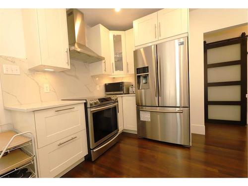 115 11 Avenue Nw, Calgary, AB - Indoor Photo Showing Kitchen With Stainless Steel Kitchen