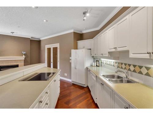 210-59 22 Avenue Sw, Calgary, AB - Indoor Photo Showing Kitchen With Double Sink