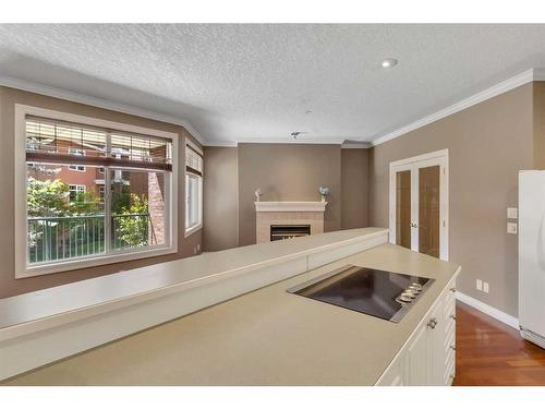 210-59 22 Avenue Sw, Calgary, AB - Indoor With Fireplace