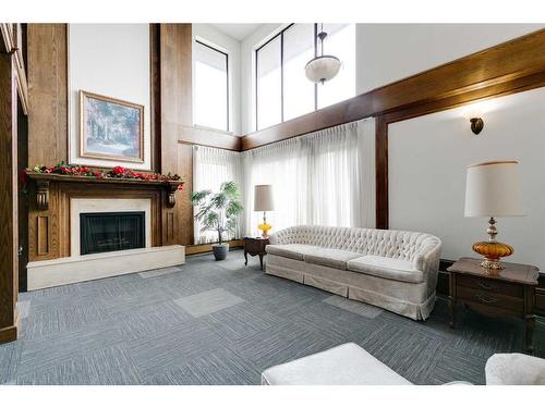 212-3719B 49 Street Nw, Calgary, AB - Indoor With Fireplace