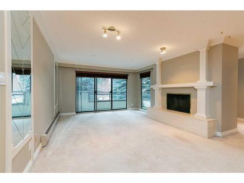 212-3719B 49 Street Nw, Calgary, AB - Indoor With Fireplace