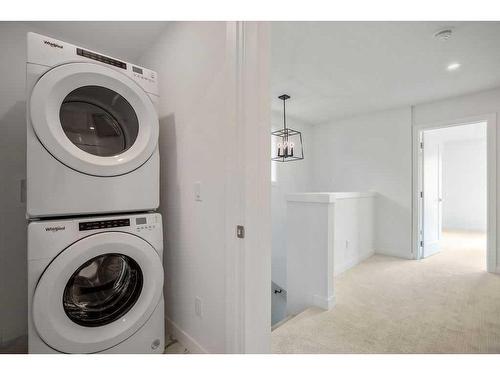 233 & 237, 225 & 229 Creekside Drive Sw, Calgary, AB - Indoor Photo Showing Laundry Room
