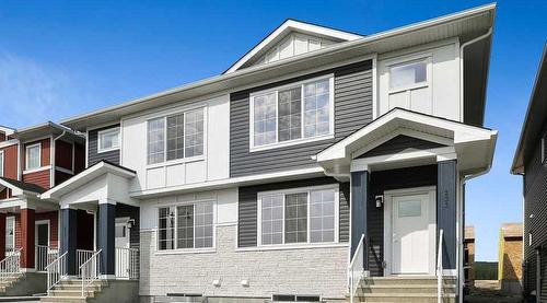 233 & 237, 225 & 229 Creekside Drive Sw, Calgary, AB - Outdoor With Facade