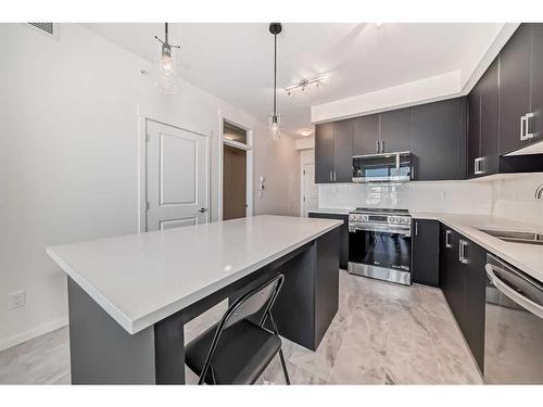 1412-740 Legacy Village Road Se, Calgary, AB - Indoor Photo Showing Kitchen With Stainless Steel Kitchen With Double Sink With Upgraded Kitchen