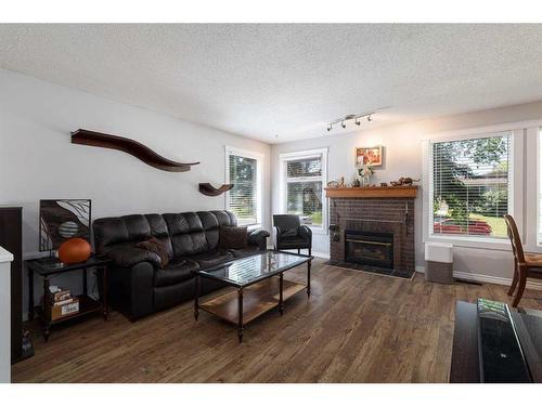 424 Pinegreen Close Ne, Calgary, AB - Indoor Photo Showing Living Room With Fireplace