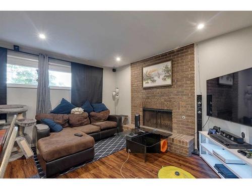 711 Parkwood Way Se, Calgary, AB - Indoor Photo Showing Living Room With Fireplace