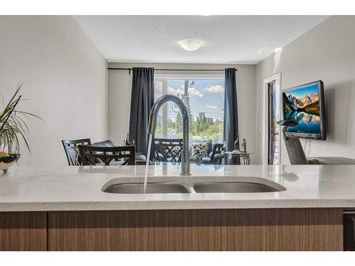 307-605 17 Avenue Nw, Calgary, AB - Indoor Photo Showing Kitchen With Double Sink