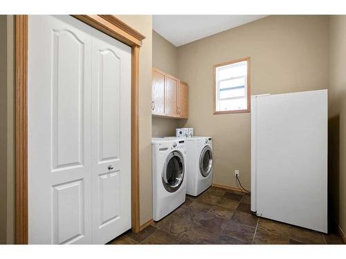 438 Silverado Boulevard Sw, Calgary, AB - Indoor Photo Showing Laundry Room