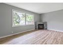 574 Killarney Glen Court Sw, Calgary, AB  - Indoor Photo Showing Living Room With Fireplace 