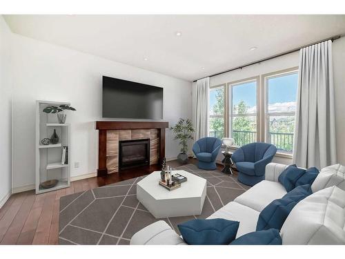 34 Auburn Springs Park Se, Calgary, AB - Indoor Photo Showing Living Room With Fireplace