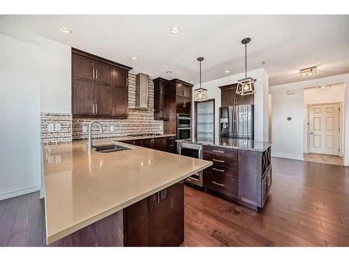 34 Auburn Springs Park Se, Calgary, AB - Indoor Photo Showing Kitchen With Double Sink With Upgraded Kitchen