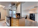 703-1225 15 Avenue Sw, Calgary, AB  - Indoor Photo Showing Kitchen With Fireplace 