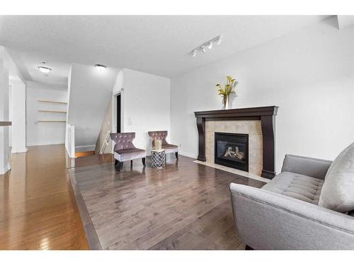101 Covepark Crescent Ne, Calgary, AB - Indoor Photo Showing Living Room With Fireplace