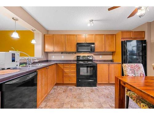 338 Elgin Point Se, Calgary, AB - Indoor Photo Showing Kitchen With Double Sink