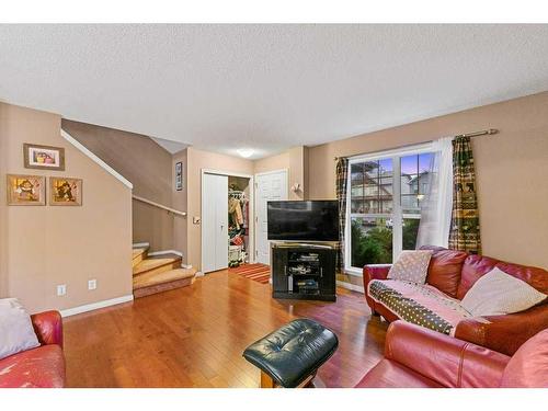 338 Elgin Point Se, Calgary, AB - Indoor Photo Showing Living Room With Fireplace