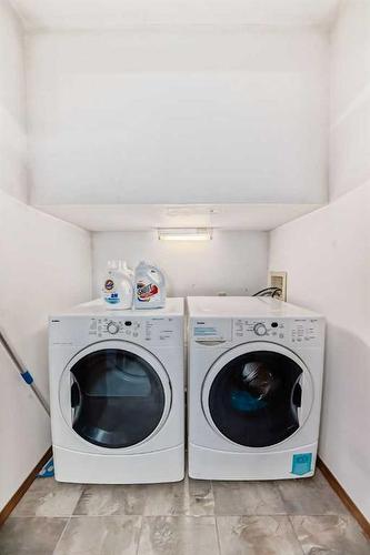 84 Deersaxon Circle Se, Calgary, AB - Indoor Photo Showing Laundry Room