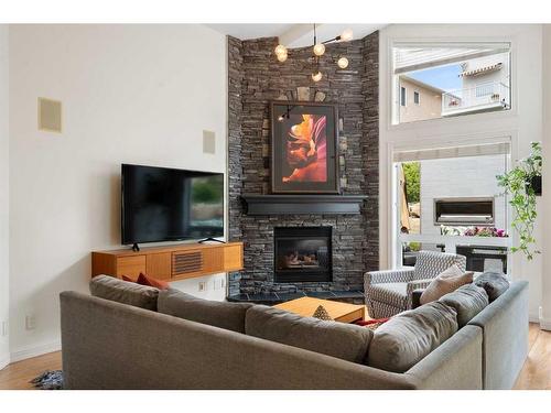 78 Sienna Park Place Sw, Calgary, AB - Indoor Photo Showing Living Room With Fireplace