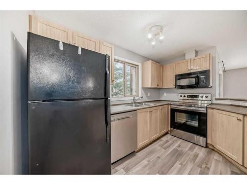 1225-60 Panatella Street Nw, Calgary, AB - Indoor Photo Showing Kitchen With Stainless Steel Kitchen With Double Sink