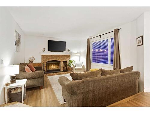 99 Mt Robson Circle Se, Calgary, AB - Indoor Photo Showing Living Room With Fireplace