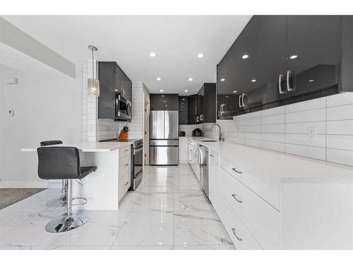 209-13104 Elbow Drive Sw, Calgary, AB - Indoor Photo Showing Kitchen With Stainless Steel Kitchen With Upgraded Kitchen