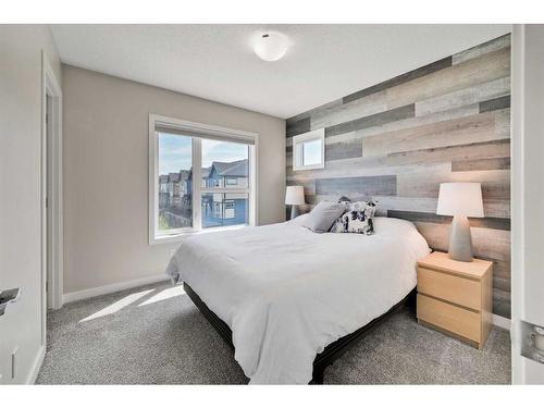 884 Belmont Drive Sw, Calgary, AB - Indoor Photo Showing Bedroom