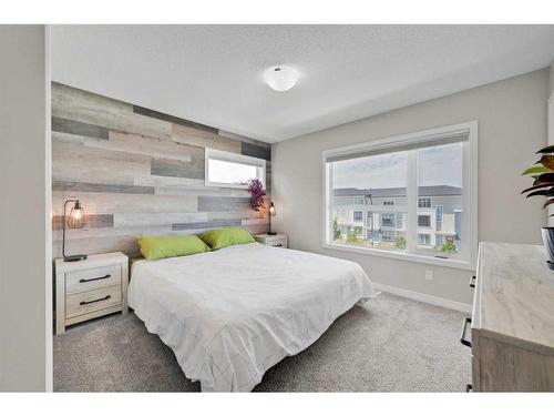 884 Belmont Drive Sw, Calgary, AB - Indoor Photo Showing Bedroom