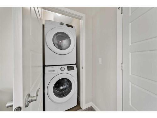 884 Belmont Drive Sw, Calgary, AB - Indoor Photo Showing Laundry Room