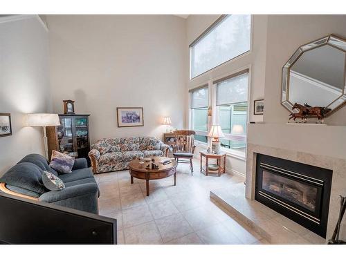 14 Woodmeadow Close Sw, Calgary, AB - Indoor Photo Showing Living Room With Fireplace