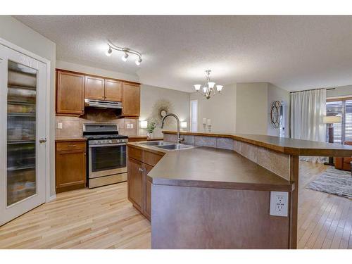 183 Cranberry Way Se, Calgary, AB - Indoor Photo Showing Kitchen With Double Sink