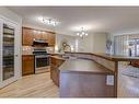183 Cranberry Way Se, Calgary, AB  - Indoor Photo Showing Kitchen With Double Sink 