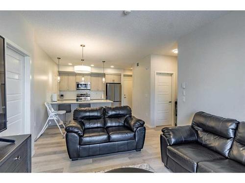 201-40 Carrington Plaza Nw, Calgary, AB - Indoor Photo Showing Living Room