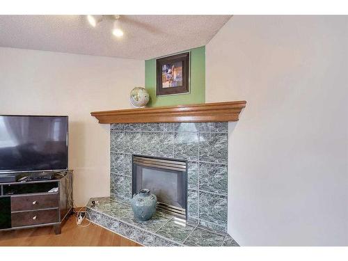 120 Citadel Close Nw, Calgary, AB - Indoor Photo Showing Living Room With Fireplace