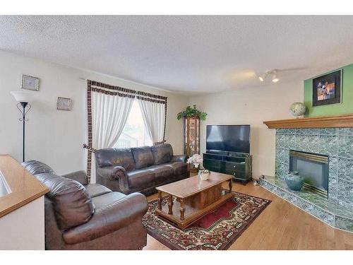 120 Citadel Close Nw, Calgary, AB - Indoor Photo Showing Living Room With Fireplace