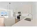 554 Rangeview Street Se, Calgary, AB  - Indoor Photo Showing Kitchen With Stainless Steel Kitchen With Double Sink With Upgraded Kitchen 