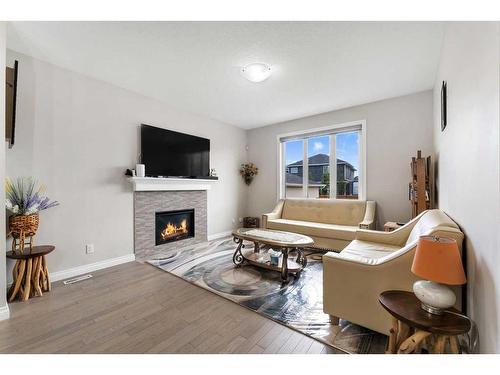 433 Redstone Grove Ne, Calgary, AB - Indoor Photo Showing Living Room With Fireplace