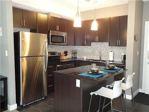 240-23 Millrise Drive Sw, Calgary, AB - Indoor Photo Showing Kitchen With Upgraded Kitchen