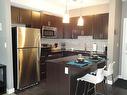 240-23 Millrise Drive Sw, Calgary, AB  - Indoor Photo Showing Kitchen With Upgraded Kitchen 