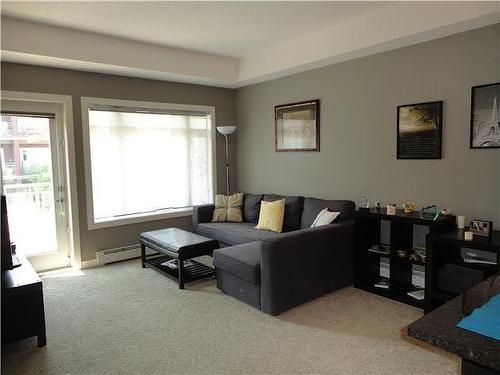 240-23 Millrise Drive Sw, Calgary, AB - Indoor Photo Showing Living Room