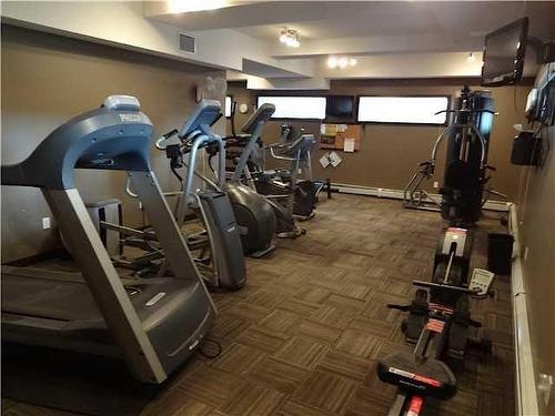 240-23 Millrise Drive Sw, Calgary, AB - Indoor Photo Showing Gym Room
