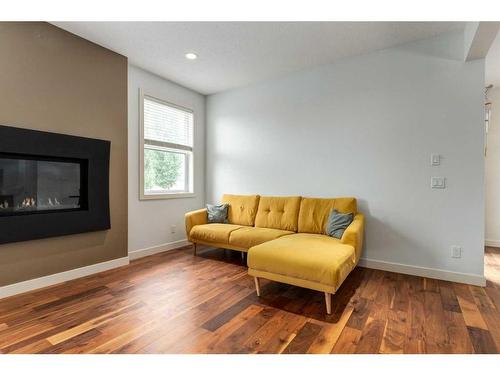 75 Evansview Point Nw, Calgary, AB - Indoor Photo Showing Living Room With Fireplace