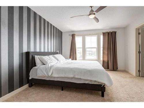 75 Evansview Point Nw, Calgary, AB - Indoor Photo Showing Bedroom