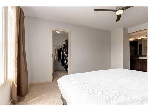 75 Evansview Point Nw, Calgary, AB - Indoor Photo Showing Bedroom
