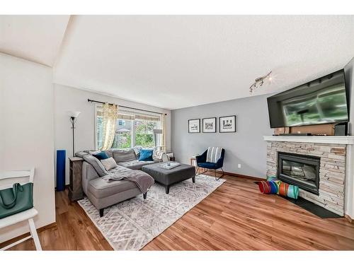 56 Somercrest Grove Sw, Calgary, AB - Indoor Photo Showing Living Room With Fireplace