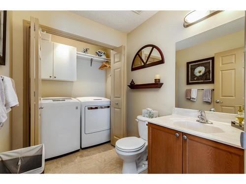 38 Crystal Shores Heights, Okotoks, AB - Indoor Photo Showing Laundry Room