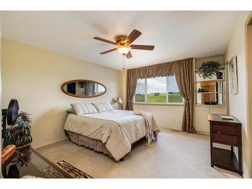 38 Crystal Shores Heights, Okotoks, AB - Indoor Photo Showing Bedroom