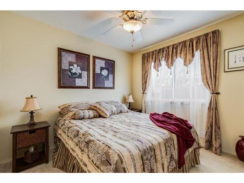 38 Crystal Shores Heights, Okotoks, AB - Indoor Photo Showing Bedroom